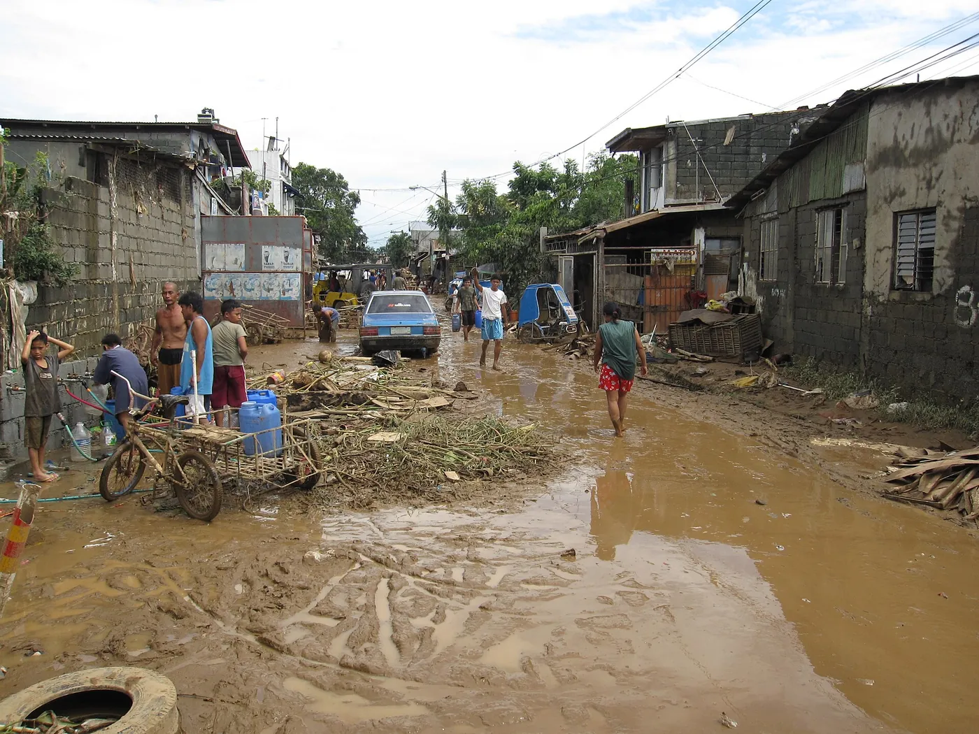 Mud and debris on a residential street in the days after the flood, 2009